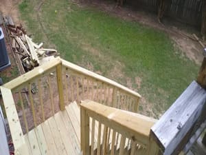 Rossman Construction crew rebuilding a deck in North Birmingham